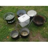 Five vintage cast iron and enamel kitchen pans of varying size, three with loose loop handles,
