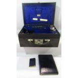 An Edwardian black Morocco leather vanity case with decent stitching throughout sturdy handle and