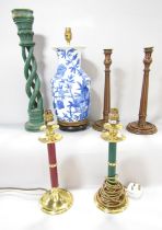 A selection of lamps, including a pair of reeded wood candlestick lamps, a red and green lamps