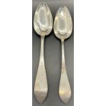 Two Scandinavian silver metal serving spoons.