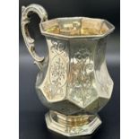 A Victorian silver octagonal shape mug with scrolled handle, Exeter 1857, makers James and Josiah