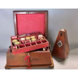 A 19th century sarcophagus shaped mahogany sewing box with wooden ring handles, with fitted top tray