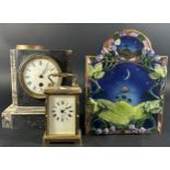 A small brass carriage clock with eight day time piece, Victorian black slate and marble mantle