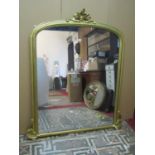 A large over-mantle mirror of arched form (re-gilded) 146 x 112 cm