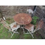 A painted weathered contemporary metal four piece garden terrace set with decorative lattice