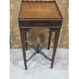 A Chippendale style square cut urn stand with pierced detail