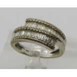 18k white gold baguette cut diamond crossover ring, size N (shank misshapen), 7.7g