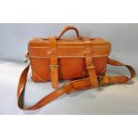 A hard wearing stiffened tan leather shoulder bag with good stitching and sound buckles and strap,