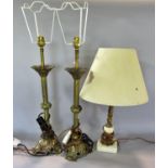 A pair of ecclesiastical brass candlesticks, converted to electric lamps, and a single brass