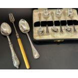 A boxed set of six silver teaspoons, a cased single spoon, a pickle fork, a single dessert spoon,