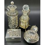 Three silver mini scent bottles two in stylish stands, one in a portable floral case, together
