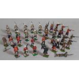 34 Britains military figures from Scottish regiments including pipers, marching and firing infantry,