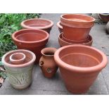 One lot of weathered terracotta outsized flower pots including three examples with Greek key detail,