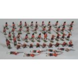 A collection of Britains hollow cast lead figures comprising Scottish regimental soldiers firing,