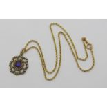 Edwardian yellow metal pendant set with an amethyst and seed pearls, 3.1cm L approx, hung from an