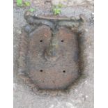 An old cast iron boot scraper with canted rectangular foliate tray base 36 cm x 25 cm x 25 cm high