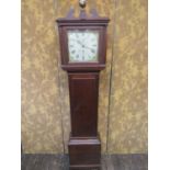A Georgian oak country made longcase clock with column supports, enclosing a square cut painted dial