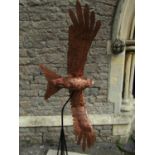 Life-size representation of a Red Kite in flight. It is made of carved mahogany overlaid