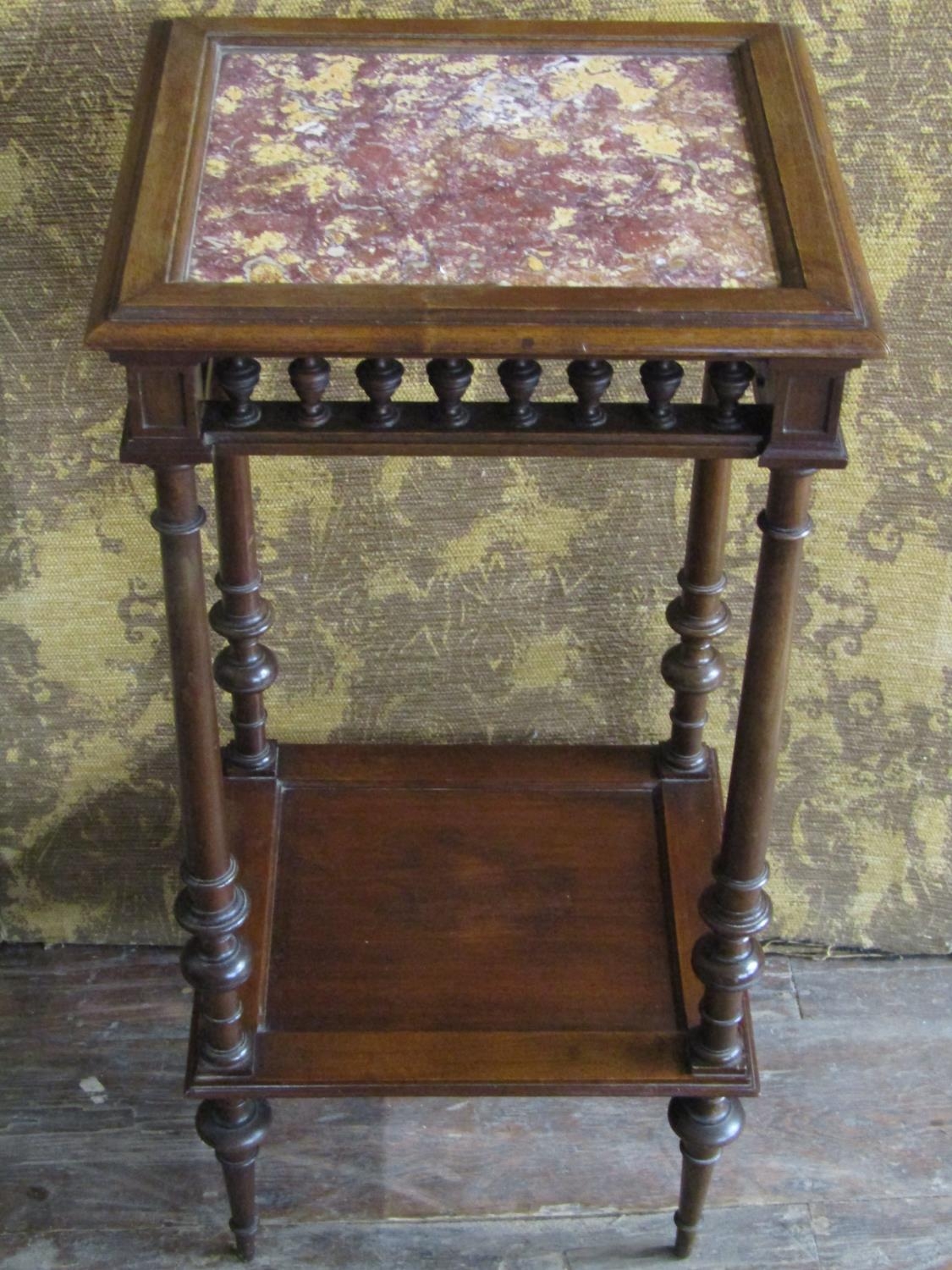 A 19th century continental marble-topped two tier torchere stand, the inset top of squared form