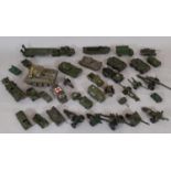 Collection of unboxed model military vehicles, the majority by Dinky, others by Crescent Toys,