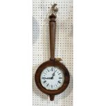 A contemporary oak kitchen clock shaped in the form of a pan surmounted by a small mouse, electronic