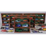 4 wooden freestanding shelf units displaying approx 60 models mainly Matchbox and Lledo