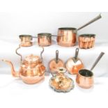 Vintage copper kitchen ware to include a jelly mould, a pair of saucepans with fitted lids, two