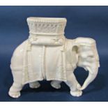 A Victorian Worcester Blanc de Chine figure of an elephant bearing a howdah, together with a