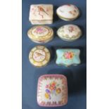 Nine porcelain boxes in various shapes, oval, egg, serpentine, circular, etc, together with an