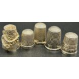 A group of five small silver thimbles, total weight 0.7oz approx