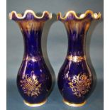 A pair of 19th century "Bayeux" dark blue 15" tall vases with gilt decoration, flared necks and