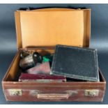A vintage suitcase containing loose silver plated flatware, a cased set of fish knives and forks,