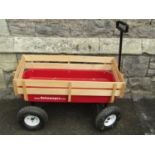 A Retrowagon with steel base, four pneumatic tyres and timber frame, 1m long x 50cm wide,