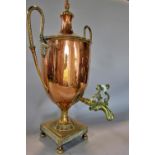 An elegant 19th century copper samovar with twin beaded brass handles and top, raised on a pierced