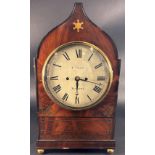 A regency period mahogany bracket clock the case with ogee outline and repeating inlaid brass