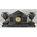 A large Victorian black slate portico mantle clock, the eight day striking movement set within six