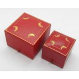 Two vintage Cartier red leather ring boxes