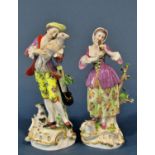 A pair of 19th century Meissen figures of a shepherd and shepherdess in 18th century dress, 26cm