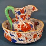 An ironstone jug and basin, the jug with serpent handle, together with a large Victorian meat