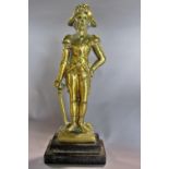 A 19th century brass door stop of a military gentleman raised on a stepped cast iron base and a