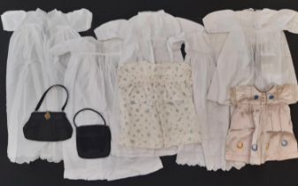Vintage textiles including white cotton baby gowns, smocked baby dresses, silk napkins,