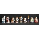 Eight boxed Royal Worcester Candle Snuffers depicting figures in a variety of styles including the