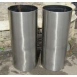 A pair of contemporary stainless steel cylindrical vessels, 38cm diameter x 80cm high
