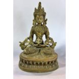 A Sino Tibetan bronze figure of a seated Buddhist figure, 21cm high.