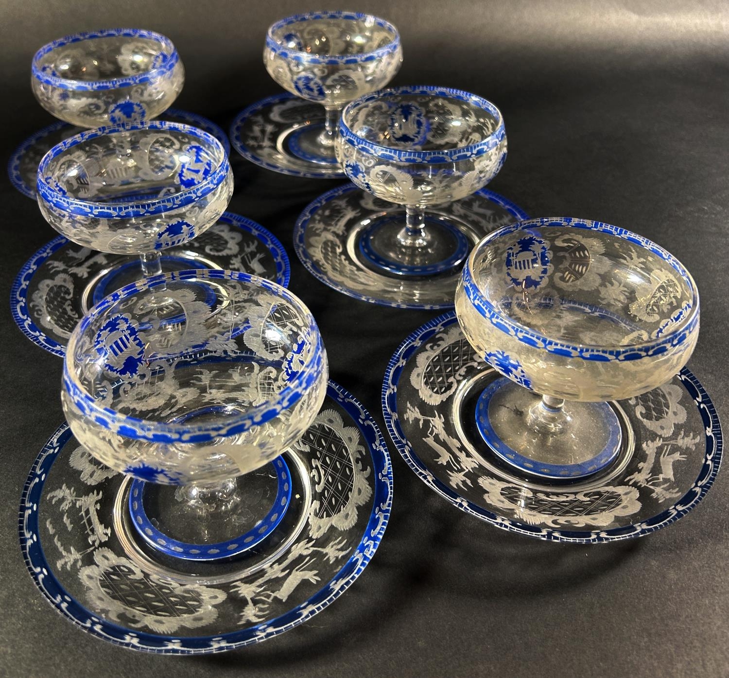 A set of six antique blue etched glass dessert bowls with saucers, with pavilion and deer decoration