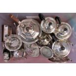 A mixed selection of silver plated tableware, including teapots, sauce boats , sugar bowls, fruit