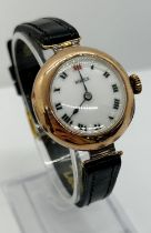 An early 20th century Rolex ladies’ 9ct gold-cased wristwatch, the white dial with Roman numerals,