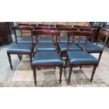 A set of ten Regency style mahogany curved bar back dining chairs with rope twist rails and