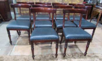 A set of ten Regency style mahogany curved bar back dining chairs with rope twist rails and