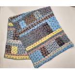 Vintage hand stitched patchwork quilt comprising a pattern of various synthetic fabrics with